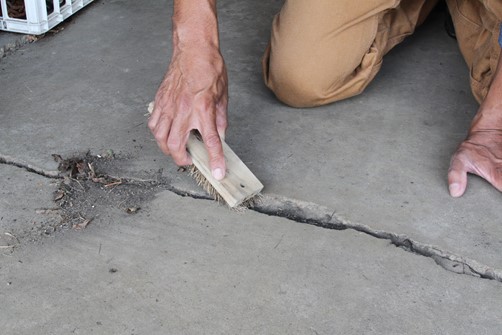 clean debris from crack