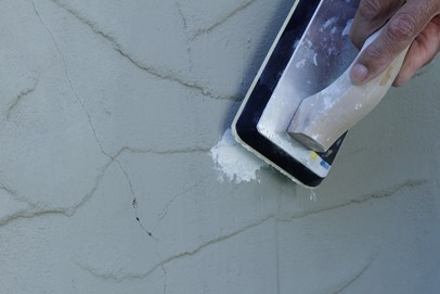 smooth the patching material